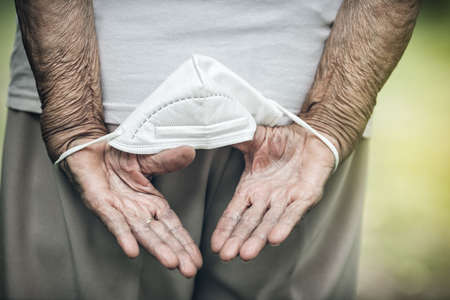 Elderly woman with a face mask during lockdownの写真素材