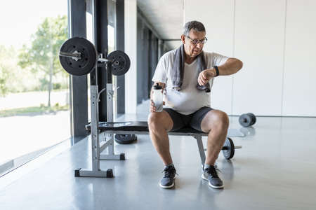 Active and healthy senior exercising in a gymの写真素材
