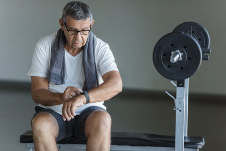 Active and healthy senior exercising in a gymの写真素材