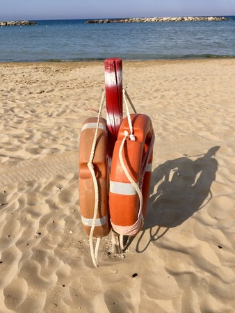 Red and White pole with life belts (Pesaro, Italy)の写真素材