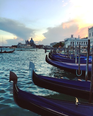 Gondolas in Venice - Landscape in Venice - Buildings in Venice at sunset (Venice, Italy)のeditorial素材