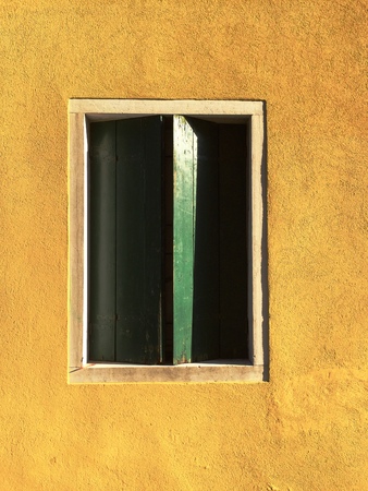 Architecture in Venice - Green Window in a Yellow Wall (Venice, Italy)の写真素材