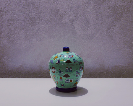 Money box on a table (Pesaro, Italy)の写真素材