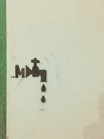 Abstract tap with drops on the wall (Pesaro, Italy)