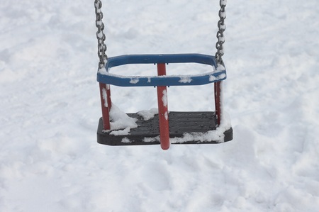Detail of a swing chair in the snow (Pesaro, Italy)の写真素材