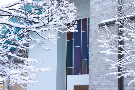 Colored window glass of a church - Snowy crucifix (Pesaro, Italy)の写真素材