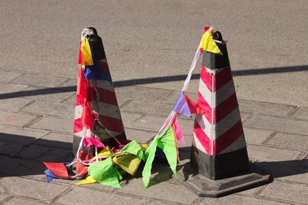 Reflector traffic cones with colored flags on the street (Kunming, Yunnan, China)の写真素材