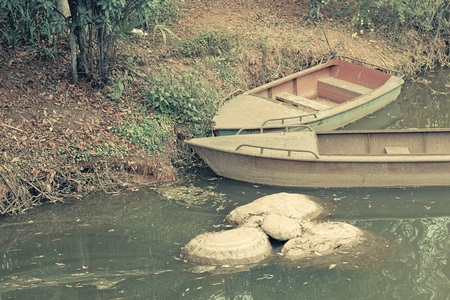 A couple of wooden boats in the lake (Kunming, Yunnan, China)の写真素材