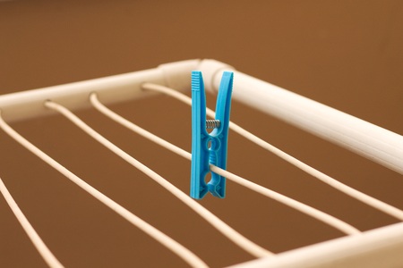 Isolated colored clothespins on the clotheshorse (Pesaro, Italy, Europe)