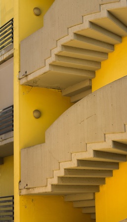 Modern rounded stairs in a yellow building (Pesaro, Italy, Europe)の写真素材