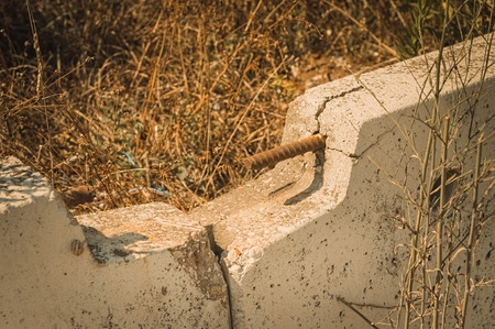 Rusted rebar into a new concrete barrier (Pesaro, Italy, Europe)の写真素材