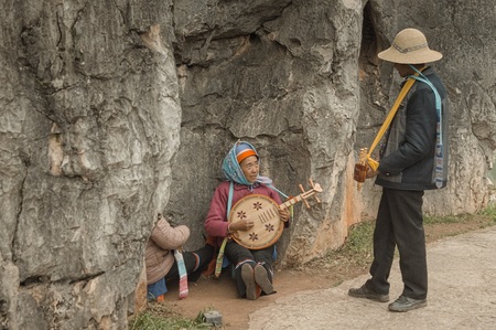 Shilin, Yunnan, China - 31 December 2017: A traditional Chinese music band in the Stone Forest