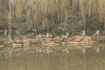 Chinese fishermen on the river bank (Kunming, Yunnan, China)の写真素材