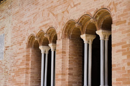 Medieval windows with round arches - Roman style details (Fiastra Abbey, Marche, Italy)の写真素材