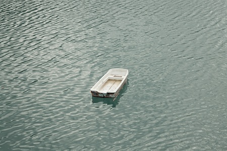 Isolated little boat on the lake - Aerial view - Marche, Italy, Europeの写真素材