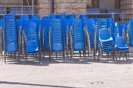 A set of blue chairs on the street (Marche, Italy, Europe)の写真素材