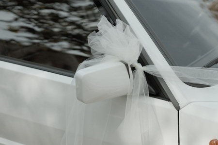 The car with a white bow on the driving mirror (Marche, Italy, Europe)の写真素材