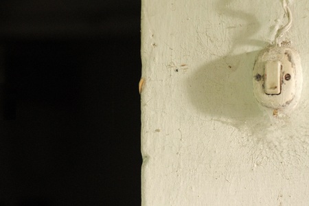 Vintage light switch in the wall (Marche, Italy, Europe)の写真素材