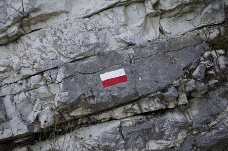 Rock side background with white and red sign (Marche, Italy, Europe)の写真素材