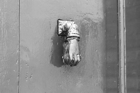 Door handle with hands (Pesaro, Italy, Europe)の写真素材