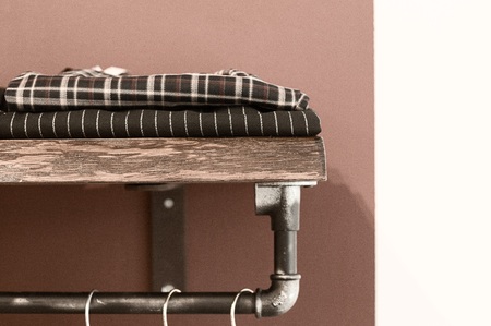 Clothes on a wooden shelf (Pesaro, Italy, Europe)の写真素材