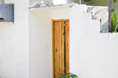 Wooden door of a white Maldivian house (Ari Atoll, Maldives)の写真素材