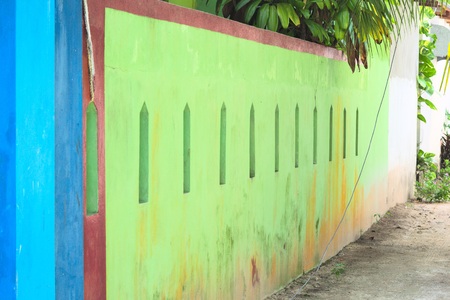 Colored maldivian house with a green wallの写真素材