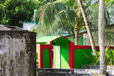 Red and green house in a tropical placeの写真素材