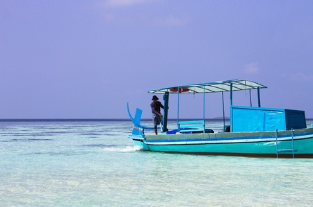 Ari Atoll, Maldives - 25 December 2018: A Maldivian sailor is fishing on his boatのeditorial素材