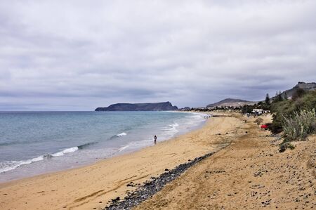 Porto Santo golden beach on a cloudy day (Porto Santo, Madeira, Portugal)の写真素材