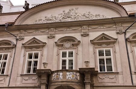 Old pink bohemian building with an isolated balcony and decorations (Prague, Czech Republic, Europe)のeditorial素材