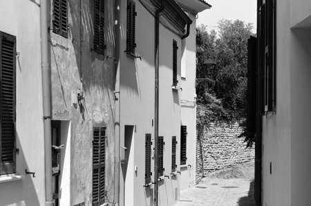 Alley of a small Italian village with old brick houses (Pesaro, Italy, Europe)