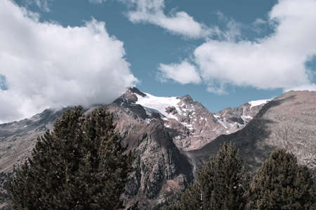 A snowy peak covered by clouds in the Italian Alps (Trentino, Italy, Europe)の写真素材