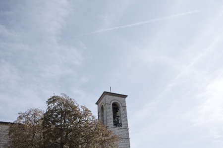 An ancient bell tower of a medieval abbey (Gubbio, Umbria, Italy)の写真素材