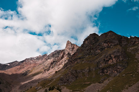 A mountain landscape with clouds in the sky on a summer day in the Italian Alps (Trentino, Italy, Europe)の写真素材