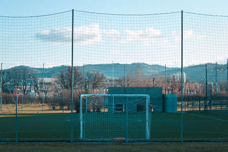 A football goal in a shady futsal field (Pesaro, Italy, Europe)