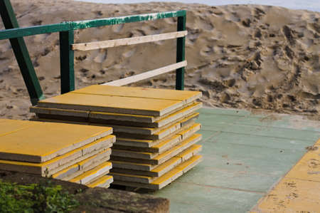 Yellow tiles stacked on the beach (Pesaro, Italy, Europe)の写真素材