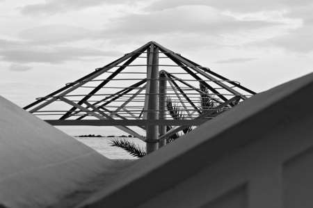Steel frame of a beach umbrella on the winter season in the Mediterranean coast (Pesaro, Italy, Europe)の写真素材