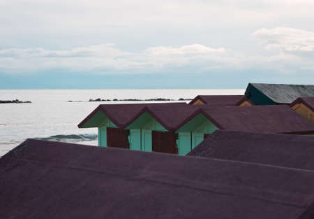 Colorful beach cabins in front of the Adriatic Sea at sunrise (Pesaro, Italy, Europe)