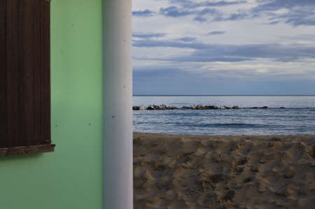 Breakwaters in the Mediterranean sea with seagulls above themの写真素材