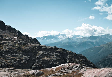 Panoramic view from a mountain peak in the italian Alps on a summer day