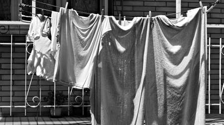Clothes hung out to dry on lines outside the balcony (Marche, Italy, Europe)の写真素材