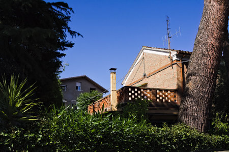 A brick balcony with a chimney behind an edge (Marche, Italy, Europe)の写真素材