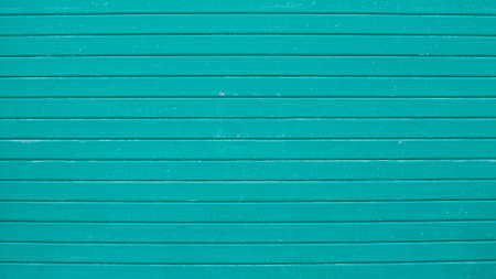 A turquoise aluminum garage shutter (Marche, Italy, Europe)の写真素材
