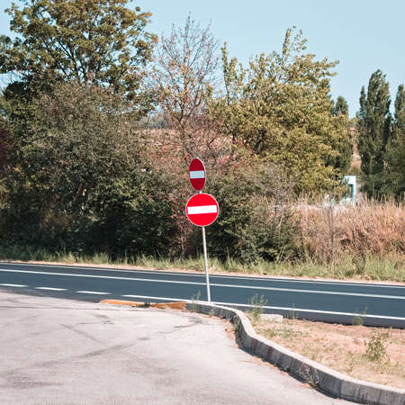 A red and white double road sign prohibiting access (Marche, Italy, Europe)の写真素材