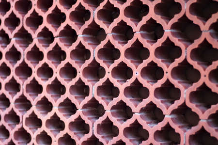 A background of a wall with ornamental ogival bricks (Pesaro, Italy, Europe)の写真素材
