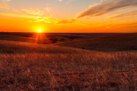 A view of the sunset in the Flint Hills of Kansas just outside of Alma, Kansasの写真素材