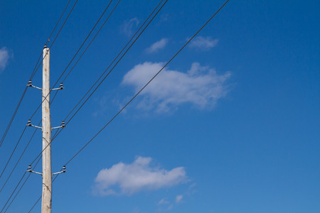 Single wooden pole with utility lines