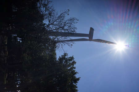 A wind turbine with blue sky in a sunny day.の写真素材