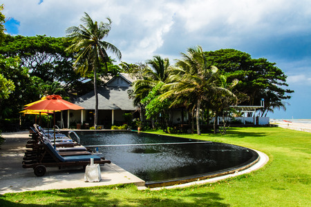 swimming pool on the beach at resort in thailand